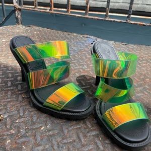 DKNY brand new heels. Never been worn. Straps are iridescent. Size 6.5